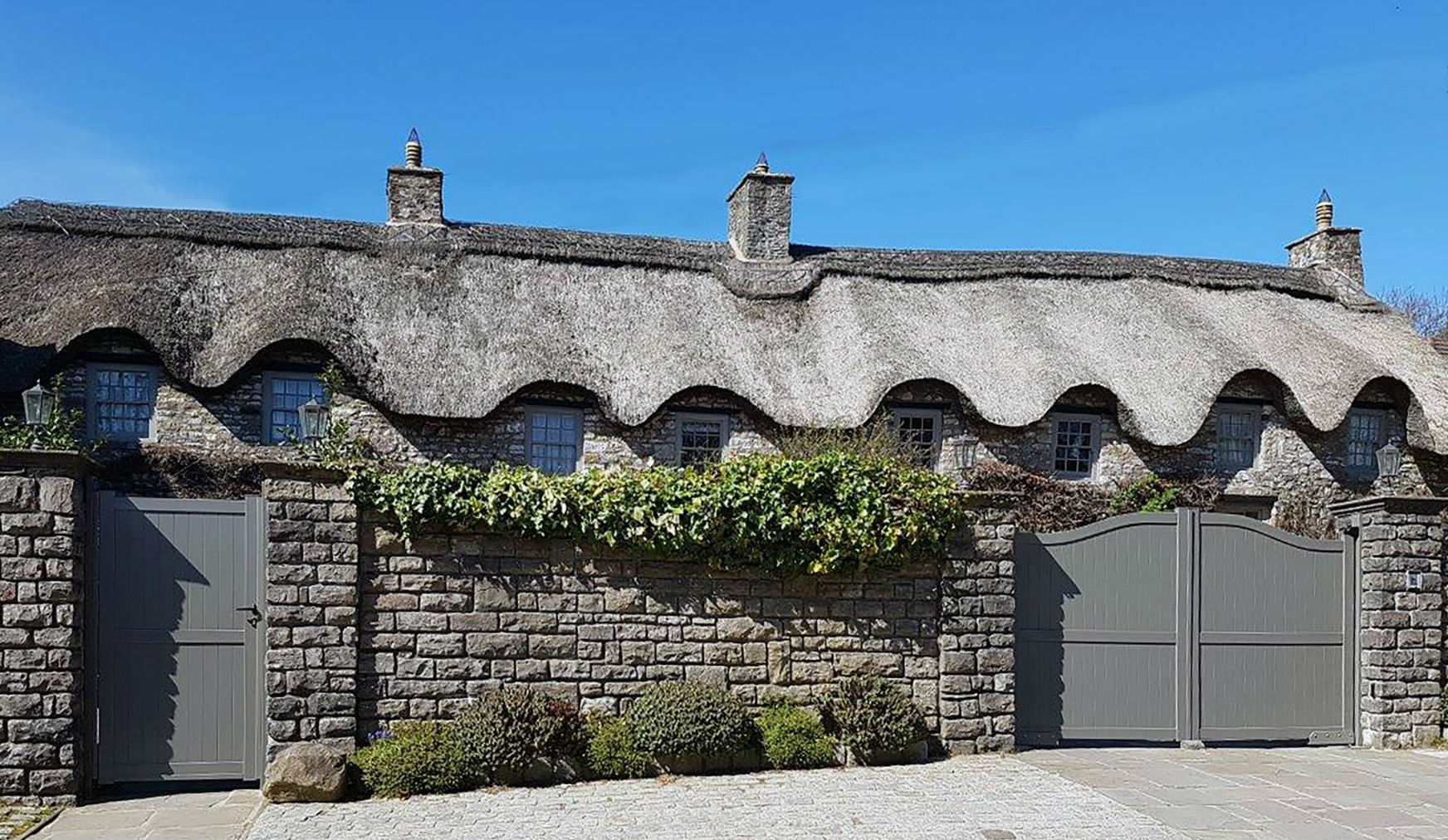 A picture of a house with gates 